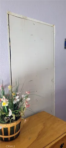 Wall repair where old bath door was