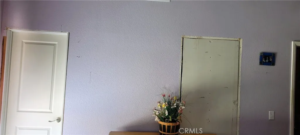 Wall needs repair on old bath door on right