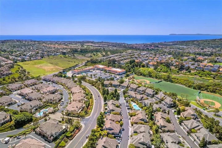 Aerial view over neighborhoods at Bear Brand, including Bear Brand Park, St Anne School, and Ocean/Catalina Island views