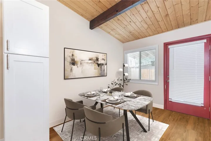 VIRTUALLY STAGED Dining area in the kitchen with access to the covered patio