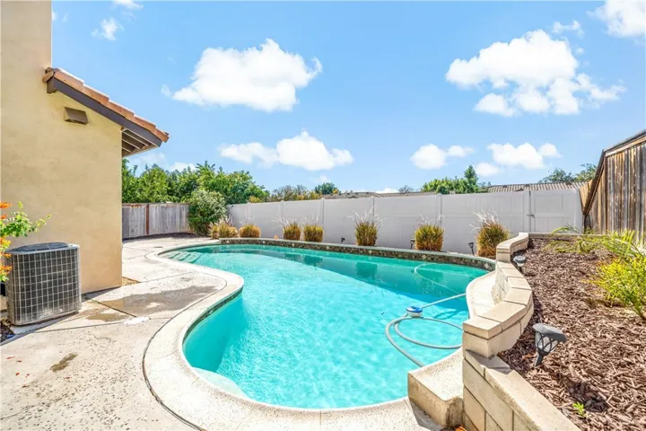 Alternate view of backyard & pool area w new vinyl fencing