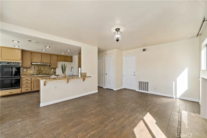 Reverse view of family w kitchen to left