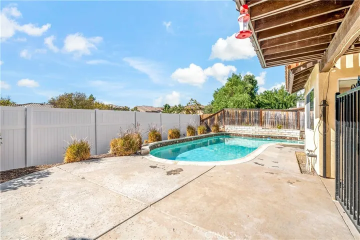Backyard pool area w new vinyl fencing
