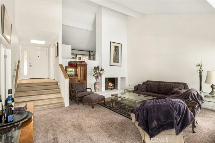 One set of 6 stairs to the living area. The 4th room is the only room on the upper area