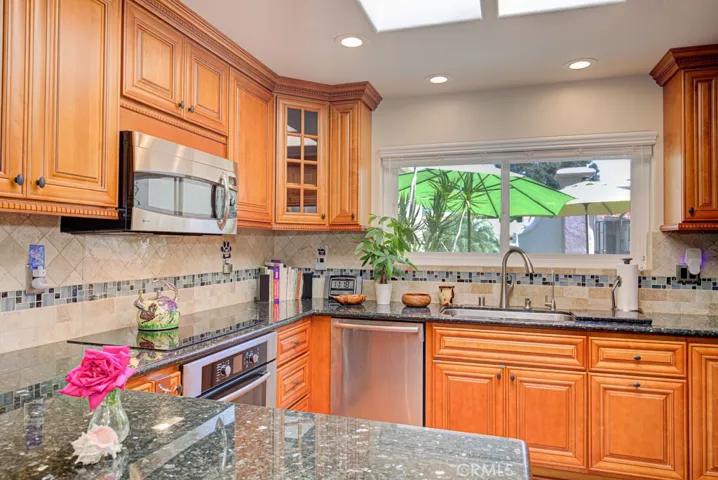 Close-up view of the kitchen. The window above the sink looks onto the front patio..