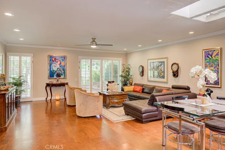 Living room view from front entry. This enormous living space easily accommodates various configurations of large furnishings.