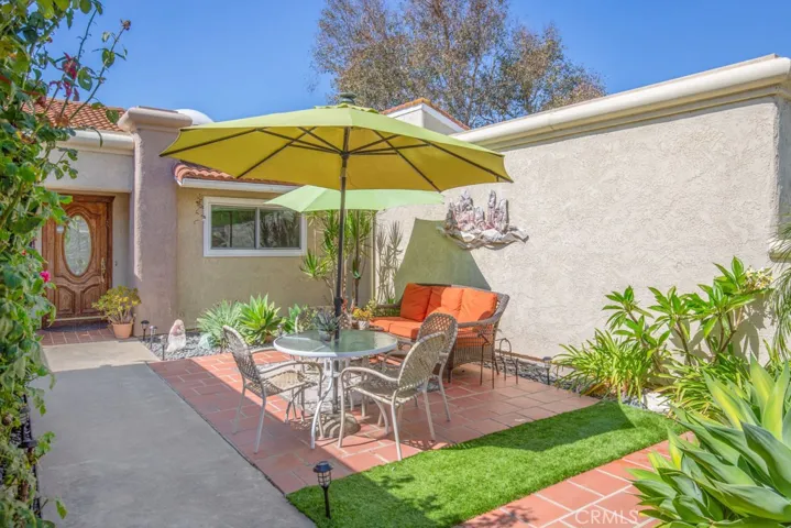 Beautiful front courtyard is immaculately landscaped and is perfectly suited for outdoor dining, entertaining or quiet relaxation.