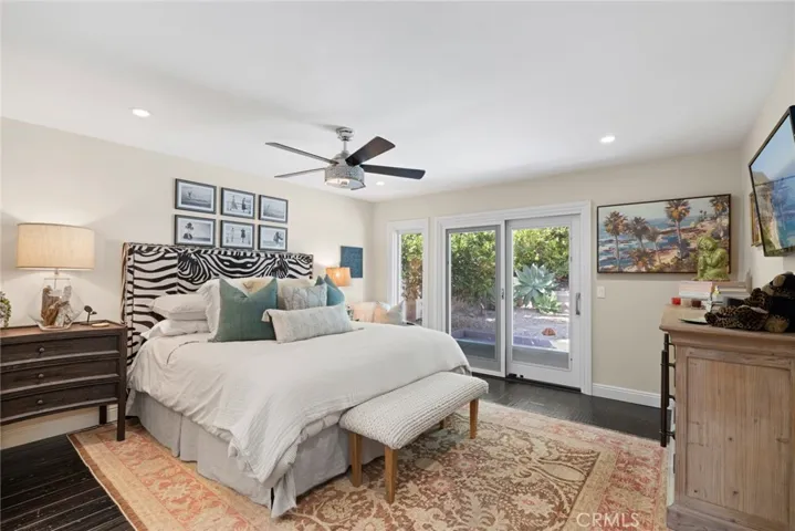 The primary suite is equally tranquil and hosts a sliding door that opens to the backyard