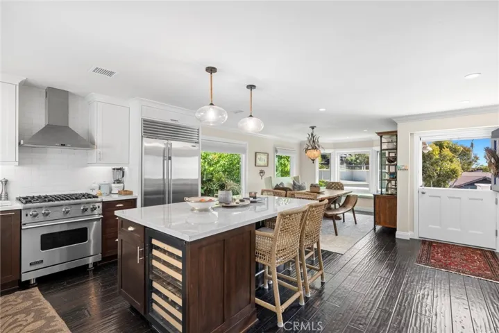 Capturing the friendly ambiance of this home, a Dutch entry door welcomes all to a dining, kitchen and family area that is arranged for maximum style and convenience.