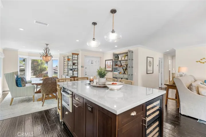 Upgrades include hardwood flooring, a roof replaced in 2021, Pella windows, and energy-efficient HVAC.