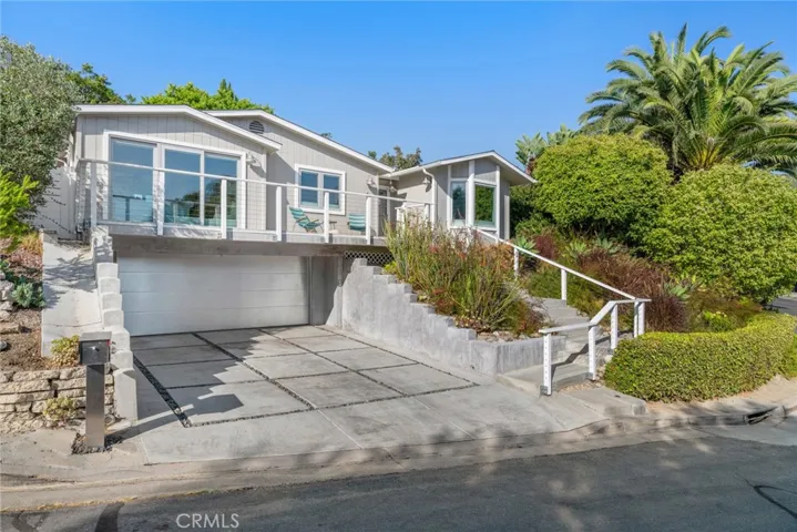 Embraced by a beautiful corner homesite in Laguna Beach’s lower Bluebird Canyon, this spectacular single-level residence blends indoor and outdoor living in a delightful environment that will enhance every aspect of your lifestyle.