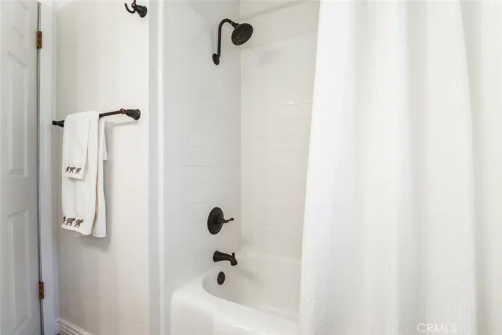 Main hall bathroom has shower/tub combo