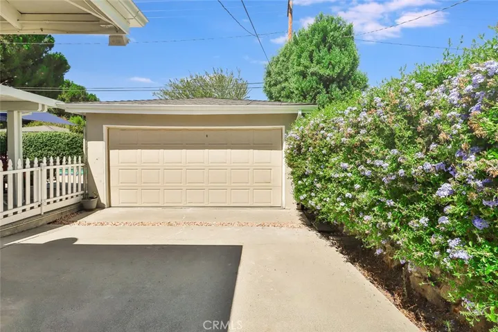 Two Car detached garage behind the metal gates