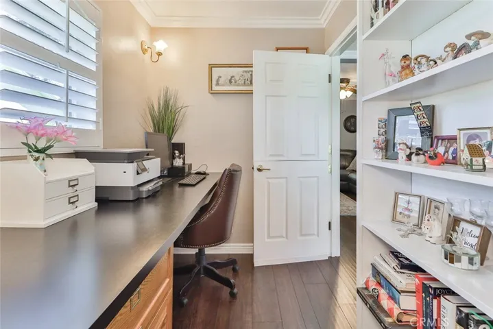 Office/small bedroom with walk in closet and built in shelves.