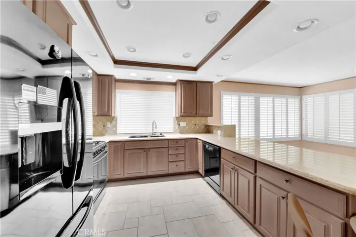 Chef's Dream Kitchen Open to Large Family Room with Plantation Shutters and Added Arizona Room with Separate Spa Room - All Open Flowing Light and Bright!