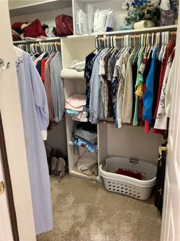 Walk-in closet in primary bedroom