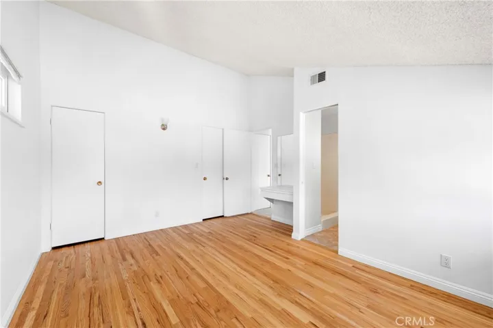 Primary bedroom with wall to wall closet