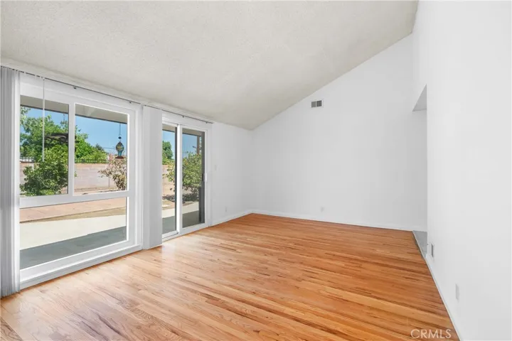 Living room with glass slider to the backyard