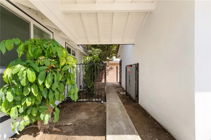Front side area to pedestrian door to the garage