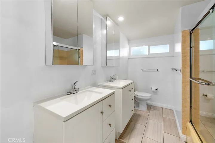 Hallway bath with new vanities