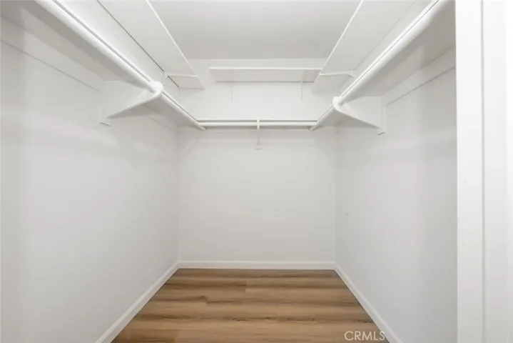 Primary bedroom has a spacious walk-in closet.