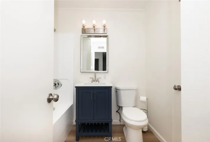 Vanity provides a pop of color with complimentary fixtures.
