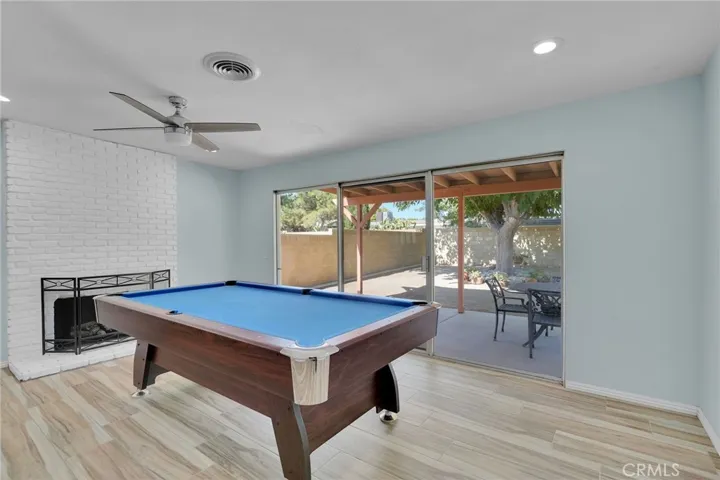 Family room can be a formal Dining room with fireplace & access to the spacious backyard.