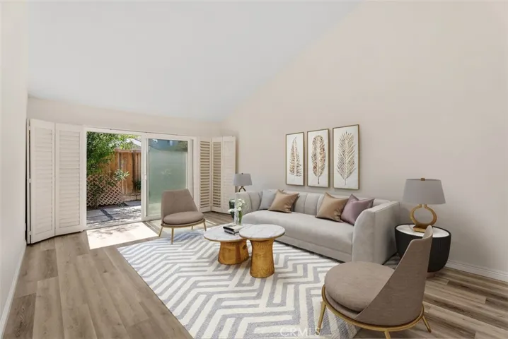 Spacious Living room with view of the private backyard.
