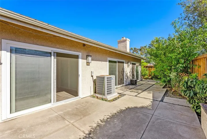 3 double pane sliders with spacious & private backyard & patio area.