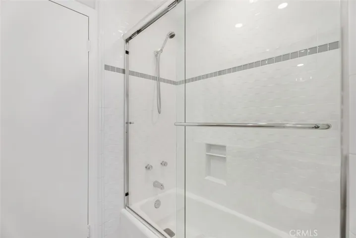 Guest bathroom with tub & shower.
