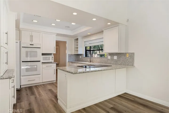 Remodeled kitchen with bar sitting.