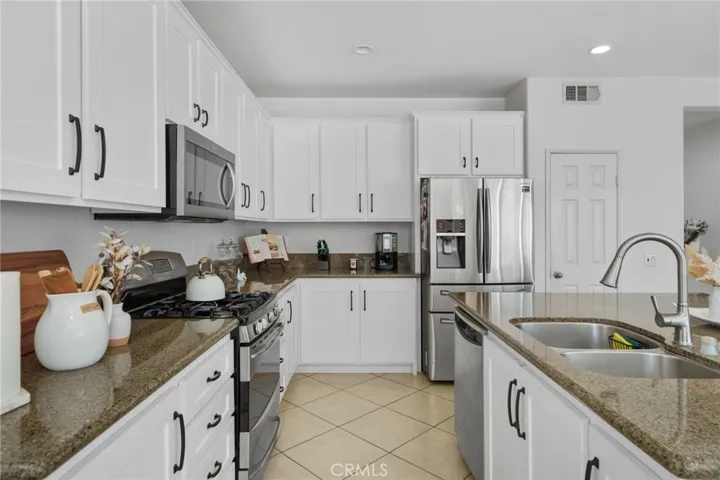 Kitchen layout spacious for meal preparation.