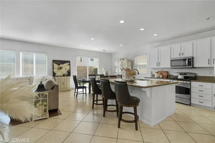 Island with bar seating in Kitchen.