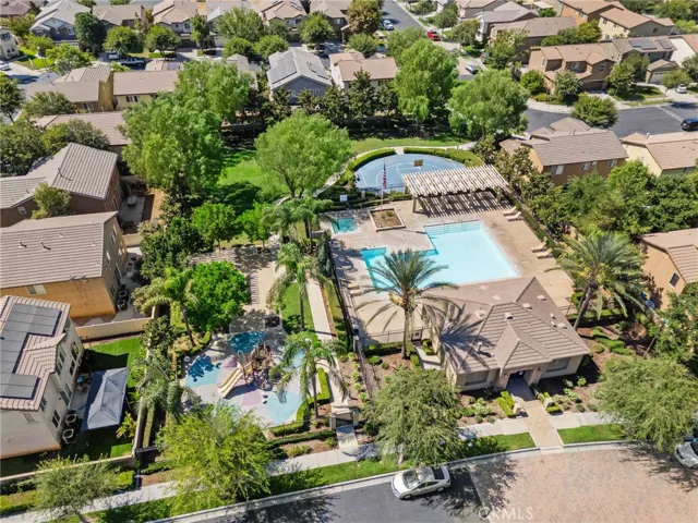 Aerial of Community facilities including pool, spa, courts and playground.