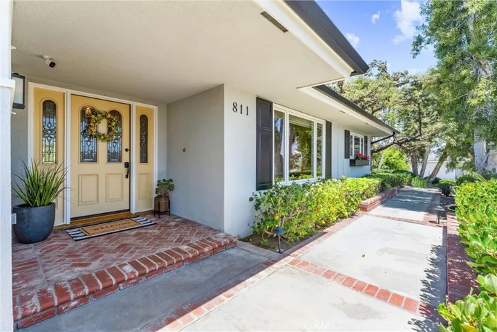 Welcome to Harmony Lane! Radiant sunshine floods through the beveled glass French door.