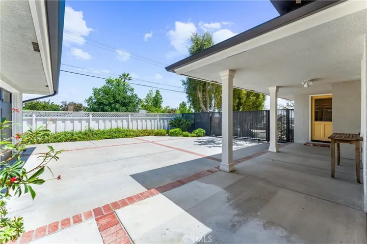 Bricked lined patio area, side door access to mudroom/laundry. This flat open patio is a great space for little ones to ride their bikes or to park cars or recreational toys.