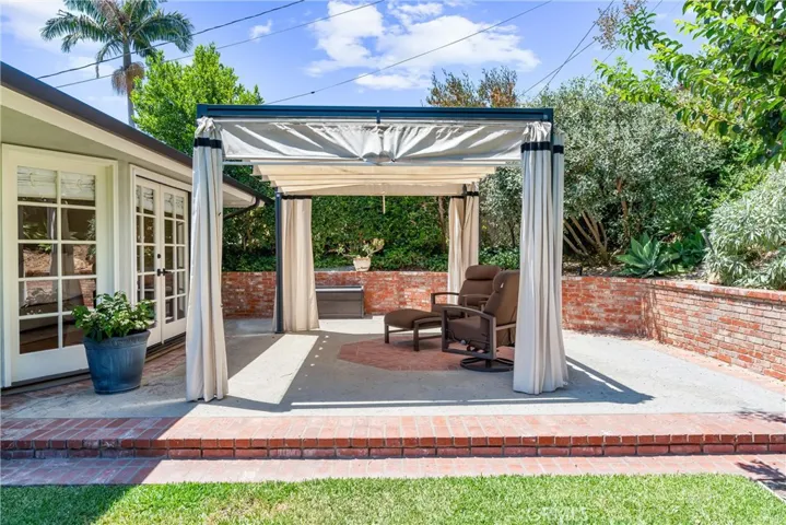 Shaded patio area perfect for morning coffee off the primary suite.