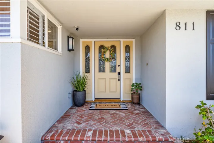 Experience luxurious living upon entering this stunning California Ranch Home. Enjoy modern conveniences such as hardwired Wi-Fi, ambient lighting with dimmers, and upscale finishes including custom crown molding and hardwood floors.