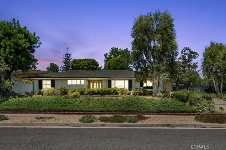 Welcome Home perched atop Harmony Lane sits a charming California Ranch home.