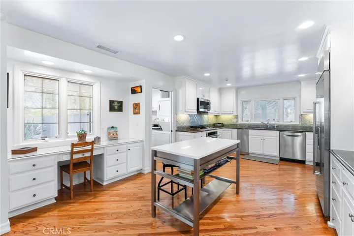 Kitchen optimized for busy lifestyles, command center desk, windows with alarm and draperies built into, laundry room with pocket door and a center island to gather round.
