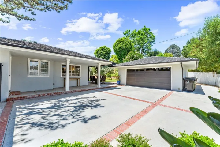 Nestled on top of Harmony Lane sits a charming single-story Ranch home on a huge parcel of land 14,036 square foot lot.