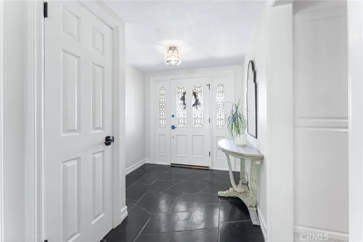 Elegant foyer is an inviting entryway for welcoming guests.