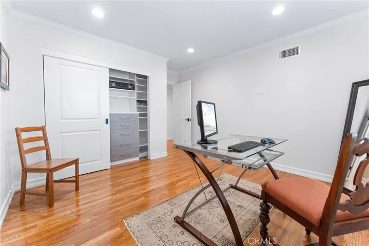 Personalized wardrobe space exudes a masculine, modern aesthetic, thoughtfully appointed. Hardwired Wi Fi makes working from home efficient.