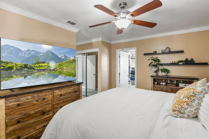 hall closet and access to adjacent bedroom that has been converted into the dream closet.