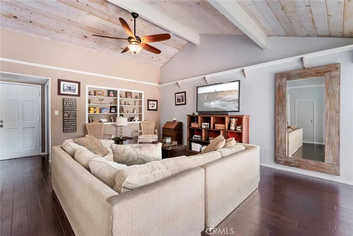 Family room with vaulted tongue and groove ceiling.