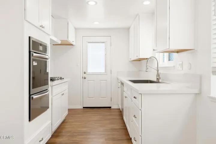 Kitchen door leads to backyard