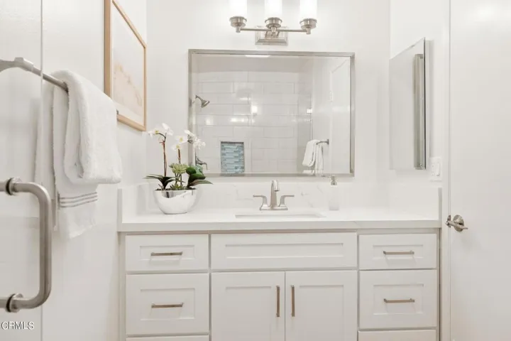 Primary bathroom has new cabinets, quart
