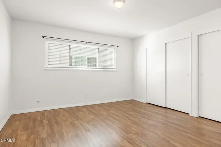 Primary bedroom with wall to wall closet