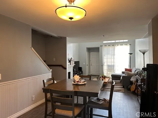Dining Room looking into Living area with fireplaced and slider to patio