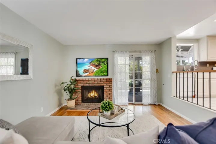 Family room with fireplace provide cozy feel and sliding door to access to backyard.